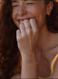 سوار "حبات النور" المتصل بالخاتم | Golden Beads Hand Chain & Ring Set