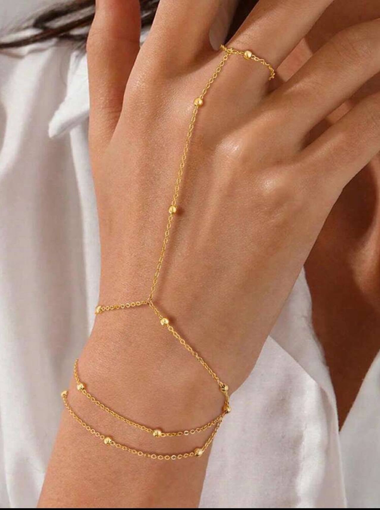 سوار "حبات النور" المتصل بالخاتم | Golden Beads Hand Chain & Ring Set